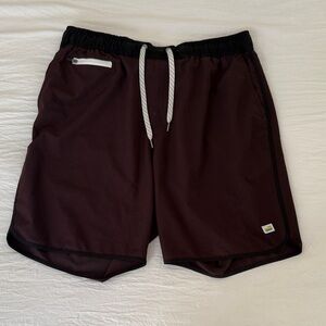 Vuori Men's Athletic Shorts in Black and Maroon.